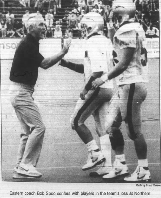 Bob Spoo confers with players